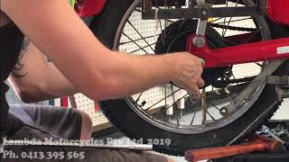 Fitting the Rear Wheel Back into a Honda CT110 Postie Bike.