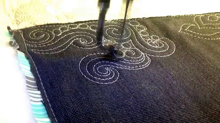 Machine quilting, combining swirls and pebbles.
