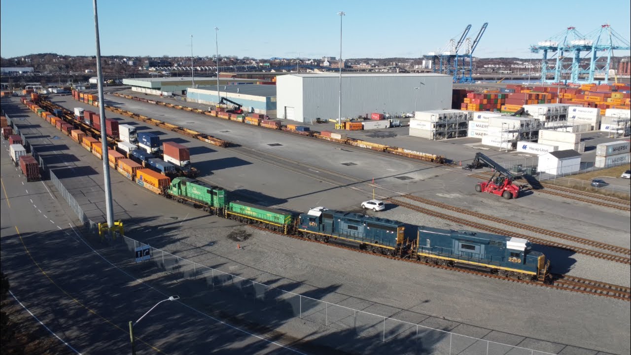 Awesome Aerial 4K View! NBSR Geeps Pull Containers from DP World Terminal - Port of Saint John