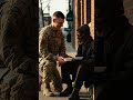a younger army man help  poor man by giving food