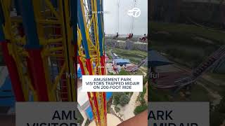 Amusement park visitors trapped midair on 200-foot ride