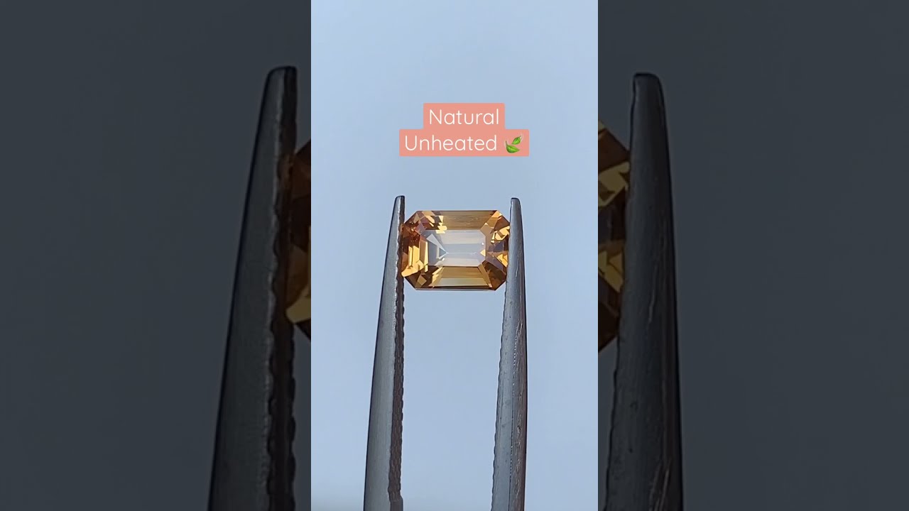 Apricot sapphire, 1.65 carats, Natural, emerald cut, golden apricot. 