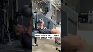 Single-arm kettlebell chest press works chest, core, &amp; glutes while building unilateral strength.