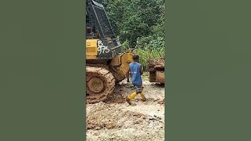 komatsu d68ess pulling logs