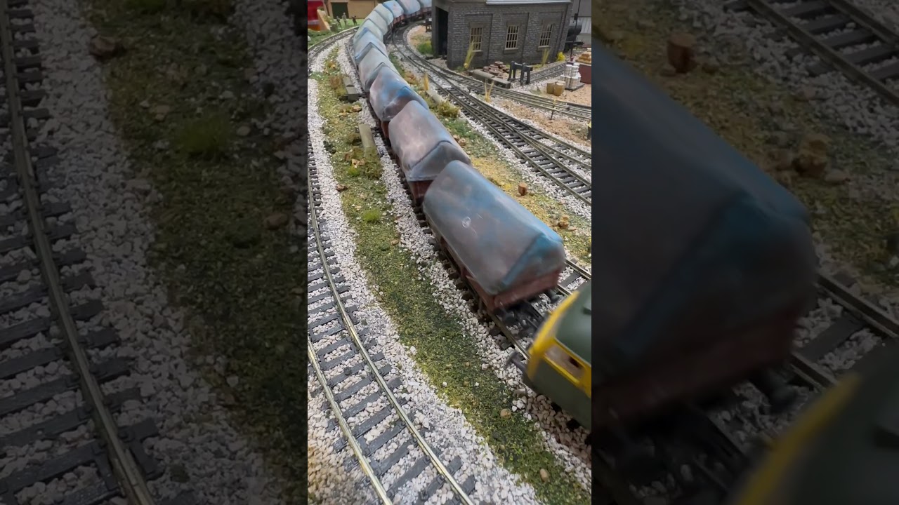 Class 47 47256 BR Green Full Yellow Ends Weathered pulling china clay wagons round the top bend.