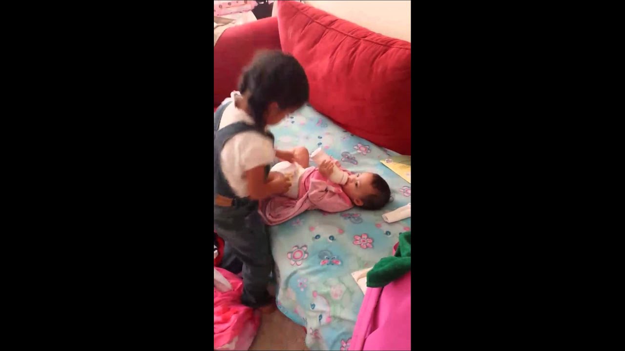 4 year old changing baby sister's diaper YouTube