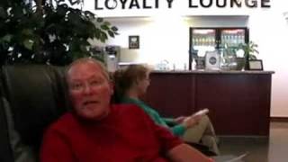 Porky sits in a massage chair at Toyota of Tri-Cities