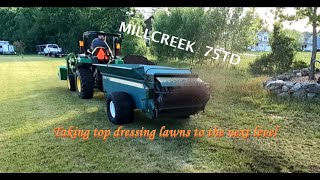 John Deere 2032R Top Dressing with a Millcreek 75TD