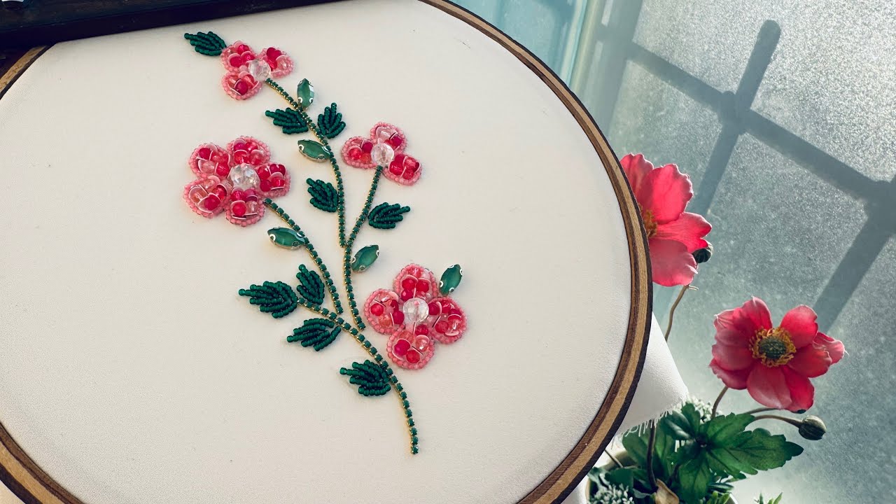 Teaching how to sew beautiful flowers with beads,sequins and crystal for clothing decorations