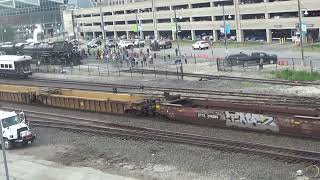 BNSF intermodal stack train passes Union Pacific 4014 Big Boy steam engine at Kansas City station.