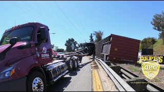 Loaded container rolls over guardrail