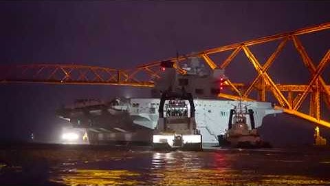 Carrier Queen Elizabeth squeezes under Forth Bridge