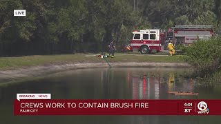 Crews working to contain brush fire in Martin County
