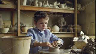 Cute Curious Child Is Making Clay Pot On Spinning Throwing Wheel In Professional Workshop. Ceramic