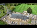 Vido arienne par drone de lglise saint pierre de touffreville en normandie