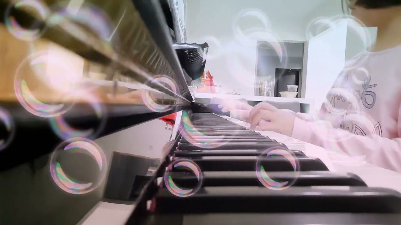 me playing piano screen on right side with bubble filter