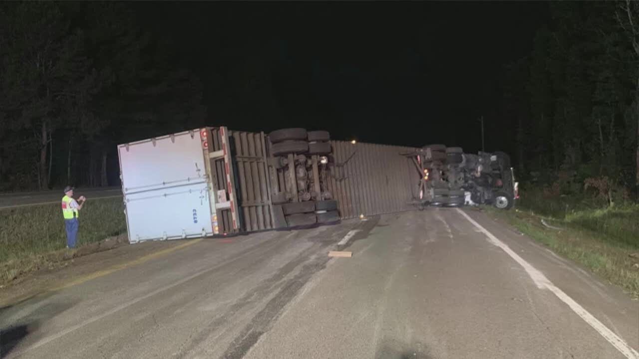 Overturned tractor trailer shuts down major highway - YouTube