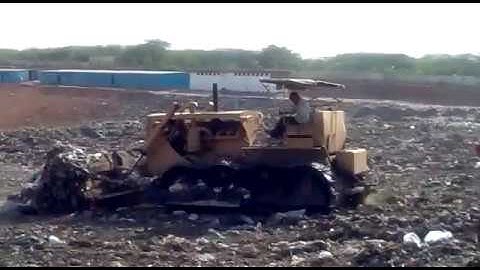 Bulldozer working at landfill site | Landfill Management |  DCC Infra Pvt. Ltd.