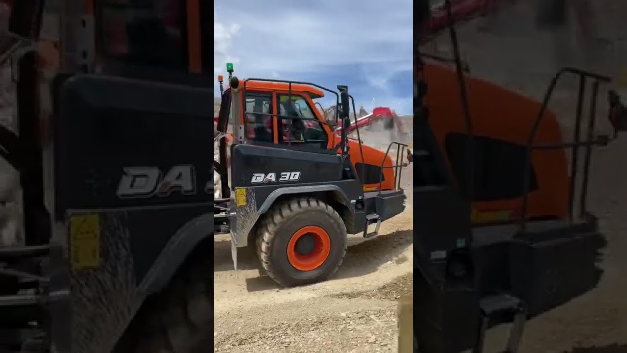 Doosan DX490LC-7 excavator loading a DA30 dump truck 