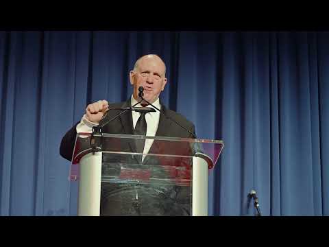 AXON Presents Tom Homan with Flag at the Big Blue Bash