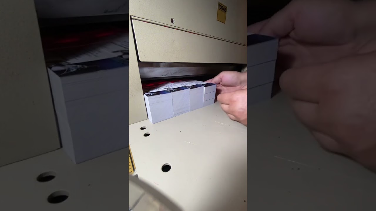 Cutting business cards with ghilotine