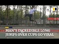 Man goes viral for incredible long jumps over cups in China