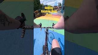 Riding west through Ankeny Rainbow Road Plaza in Portland, Oregon