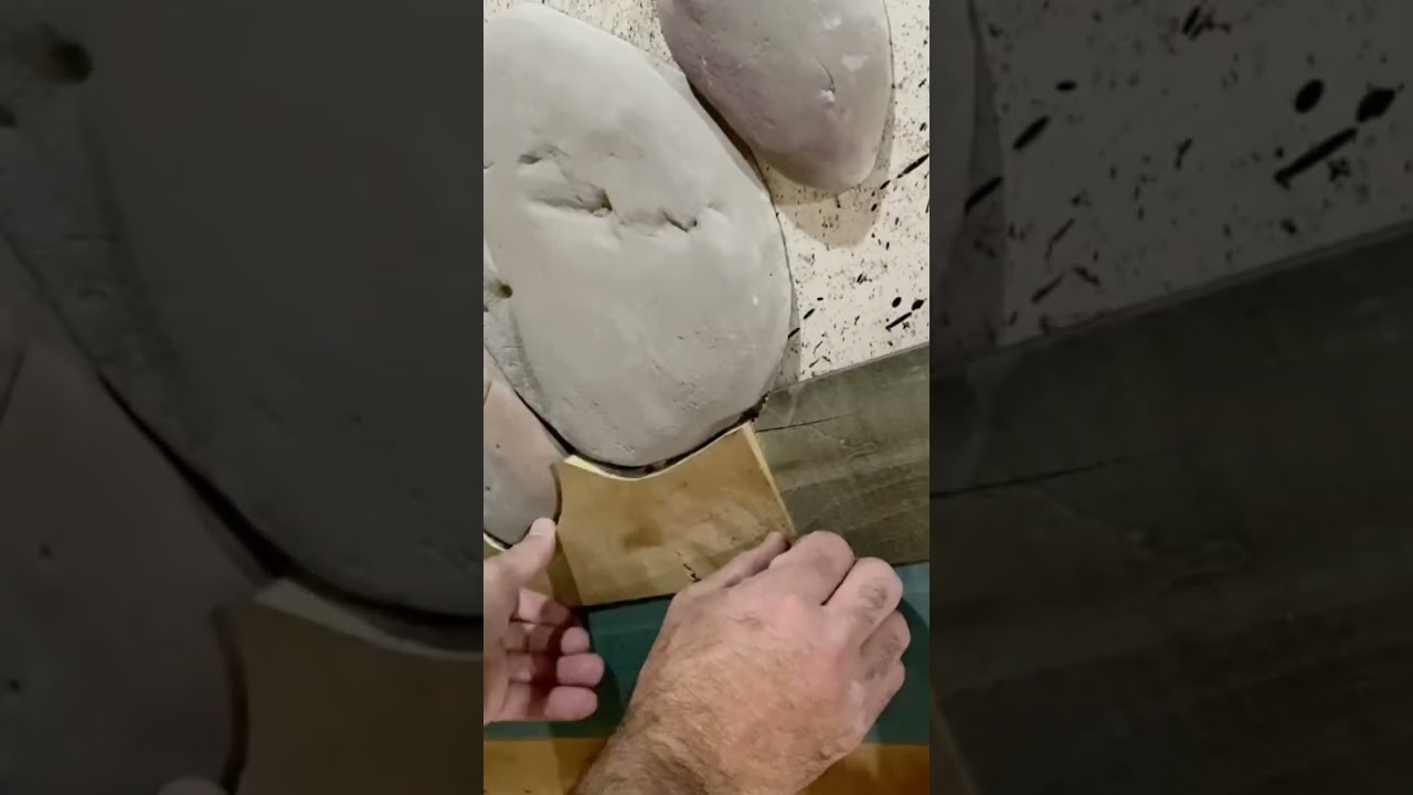 Stone veneer basement wall with wood planks