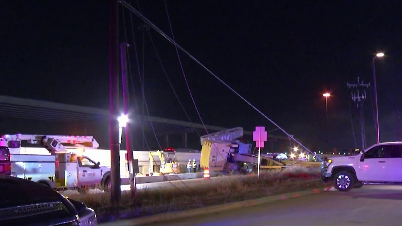 Construction crane falls over on I-35 access road, causing brief ...