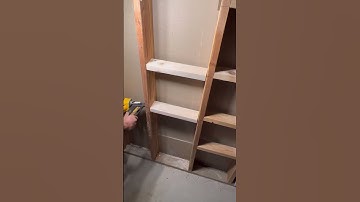 Using the space between studs on a unfinished wall for storage. #diy#storageideas #organization