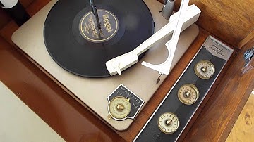 RCA stereo automatic record player playing a 78 RPM, 10 inch record