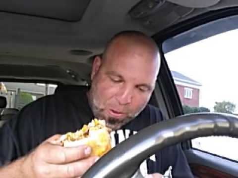 CRAZY MAN EATS CHEESBURGER ON SDIE OF ROAD