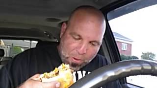 CRAZY MAN EATS CHEESBURGER ON SDIE OF ROAD