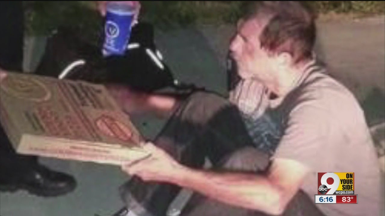 Photo of Middletown officer giving pizza to homeless man goes viral
