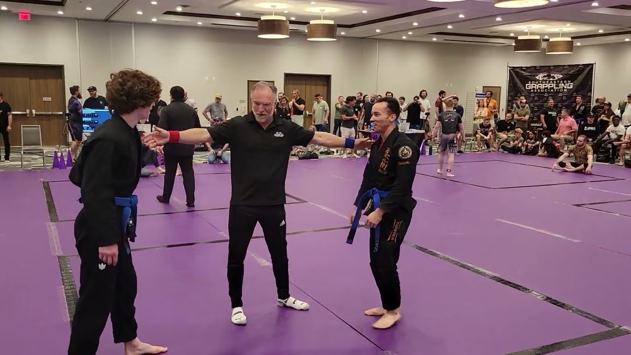 Disqualification in BJJ Blue belt match for slamming out of triangle choke. Holy City Sub Series