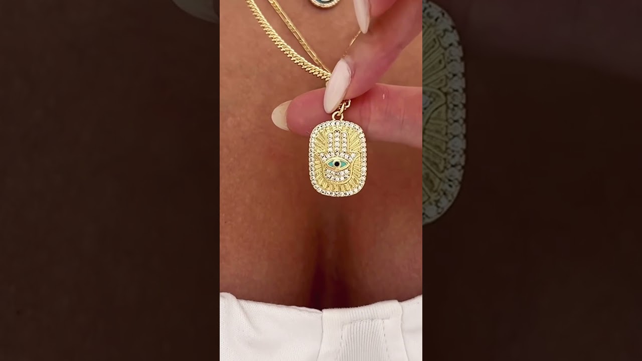 Introducing our gorgeous double-sided hamsa hand necklace in turquoise and gold 💙✨ A beautiful