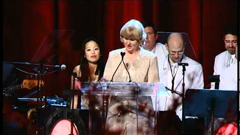 Kathy Lund accepts the Cardinal's Award