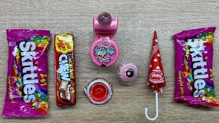 ASMR candy. Satisfactory video. Unpacking pink candies, chewing gum,Skittles, jellies and chocolates