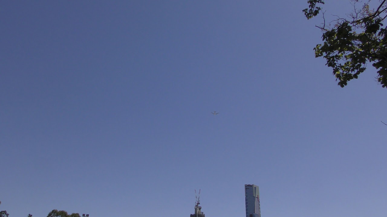 Plane flying over Melbourne City YouTube