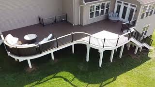 Beautiful Curved TimberTech Dark Roast Deck, Keylink Drink Rail, Post Cap Lighting, Riser Lighting