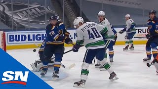 Elias Pettersson bats puck out of mid-air to score on Jordan Binnington