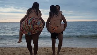 Strong Men Lifting Up Girls On The Beach