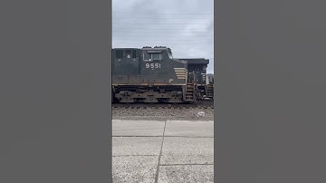 NS Dash 9 leads a northbound grain train by the coal train at Portsmouth, OH