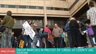 Group marches in protest of 'ongoing crisis' at Cuyahoga County Jail