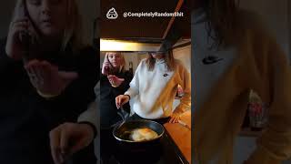 Daughter receives cooking advice from mother while making eggs