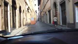 Driving through the old centre of Florence in Italy