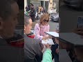 Emma signs for fan at Paris fashion week (2025) xx