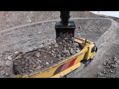 Hidromek Excavator I loaded stony material onto trucks