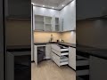 This cream modular kitchen showcases sleek handle-less cabinets, premium finishes, and a seamless.