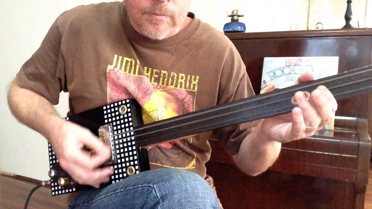 How to play Get Back on a 3 string slide cigar box guitar by Nigel